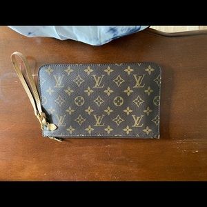 AUNTHENTIC Louis Vuitton GM wristlet.